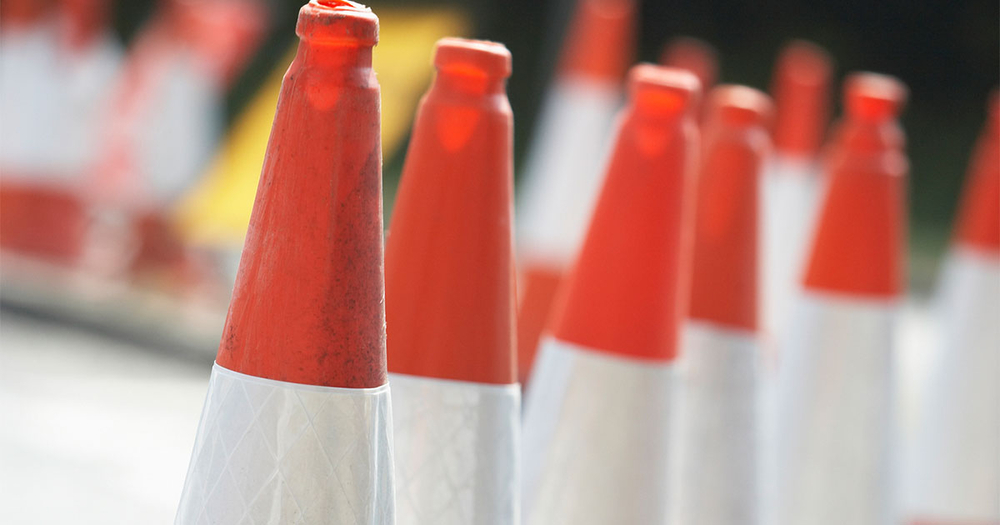 Traffic cones on a busy street