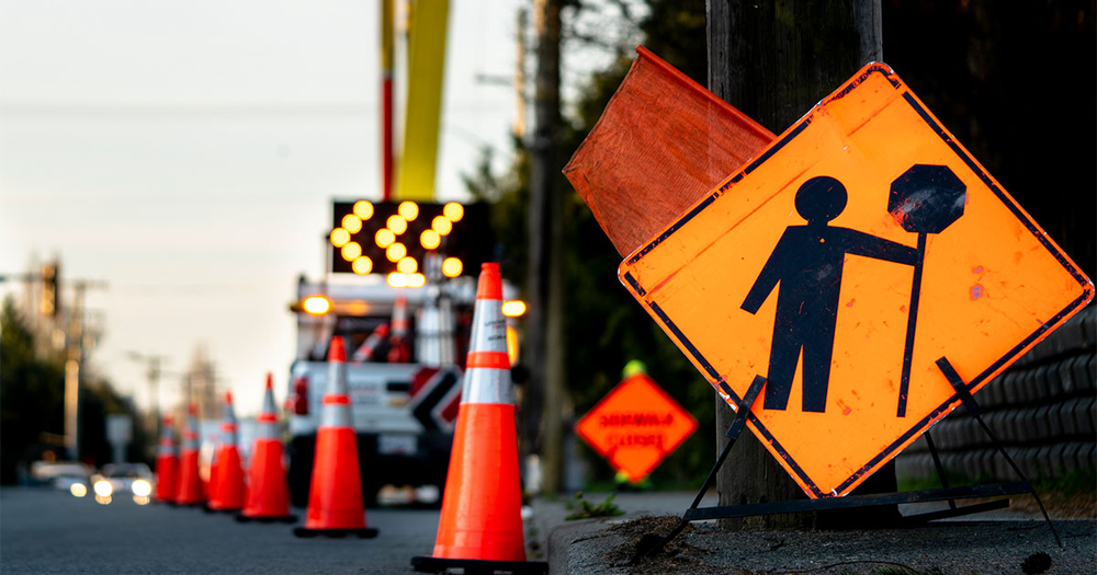 Construction sign of man holding stop signal