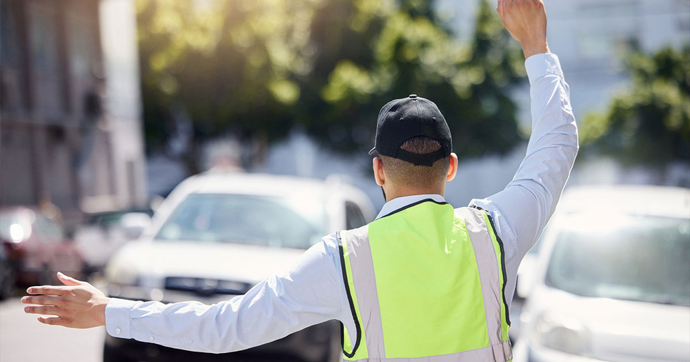 Road worker directing traffic