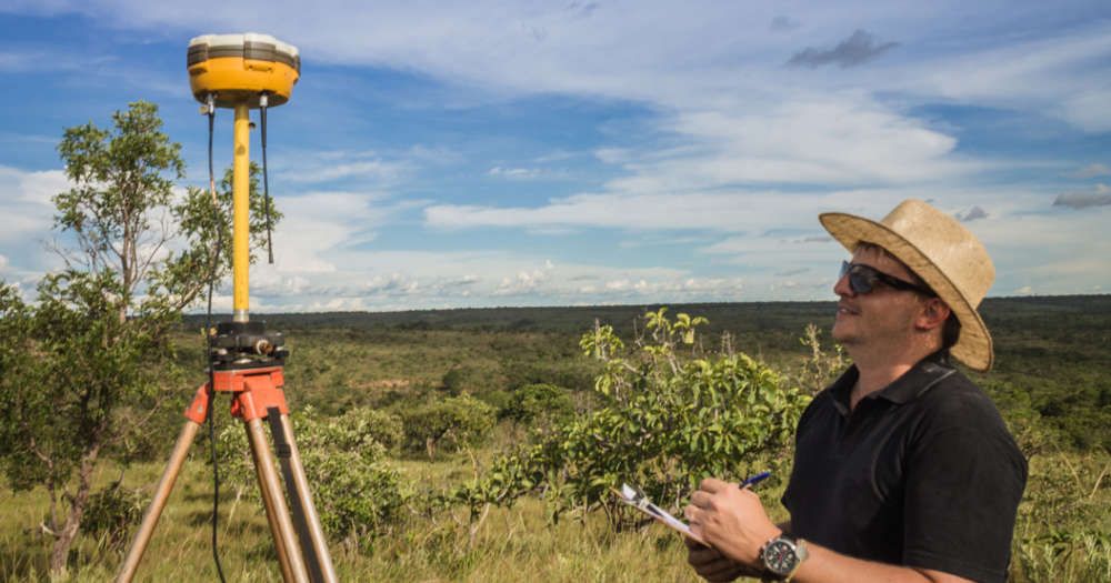 A land surveyor using GPS land surveying equipment from Baseline Equipment Company.