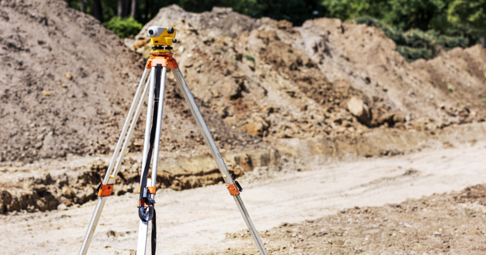 A total station ready for land surveying.