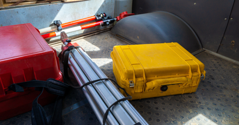 A truck bed filled with GPS land surveying equipment from Baseline Equipment Company.