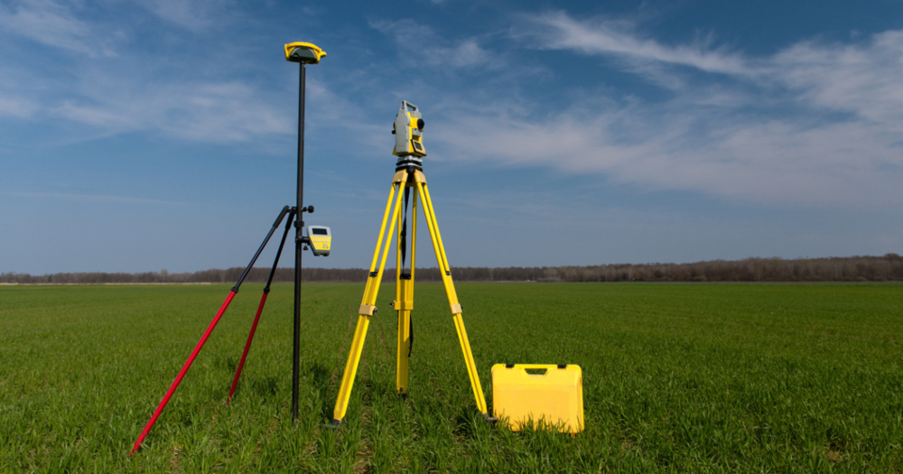 Different GPS land surveying equipment from Baseline Equipment Company out in a field.