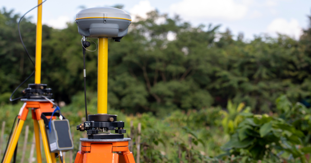 GPS land survey equipment in a forest.