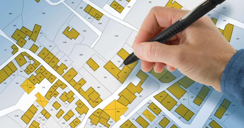 A man mapping out property boundaries after using a GPS land survey.